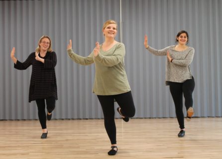 Three female adults dancing