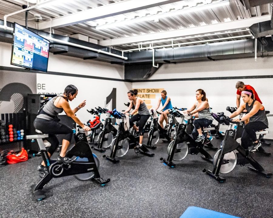 Group cycling in a Indoor Cycling Class
