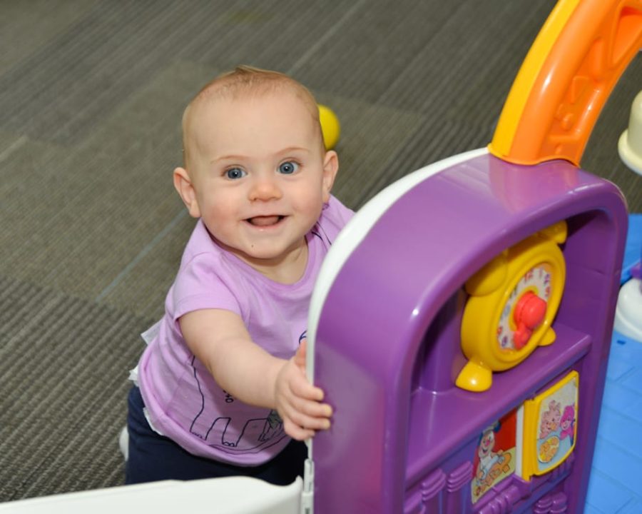 Baby playing at the Kid Zone Drop-off Childcare program