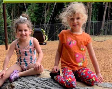 Two young girls sitting at MJCCA Schiff School (Sandy Springs) - Preschool Summer Camp