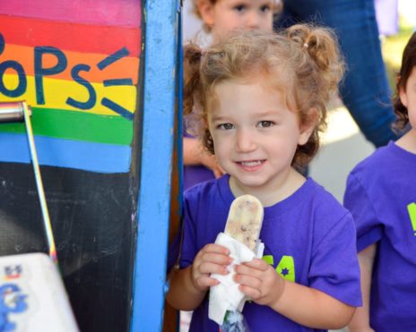 Girl holding snack at MJCCA Schiff School (Sandy Springs) - Preschool Summer Camp