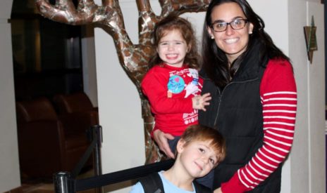 festive mother and two children at Shabbat & Jewish Holiday Program