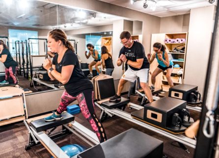 Adults exercising at STOTT Pilates