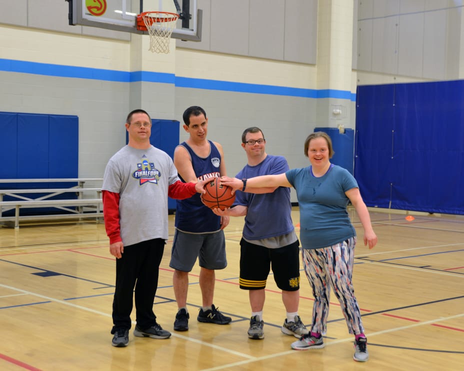 People with special needs holding a basketball