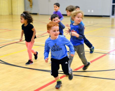 Kids running in the gymnasium