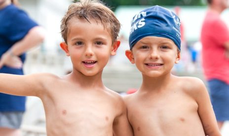 Two boys at swim team smiling