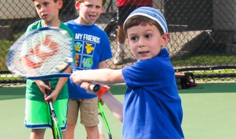 Boy swinging a tennis racket